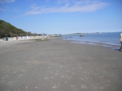 grand lonely beach in summer after rain