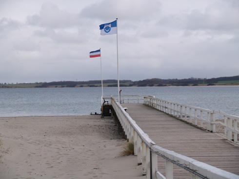 wooden landing stage at the sandbeach